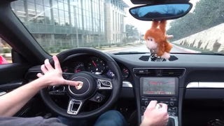 Man appears to play Doom in Porsche 911 using driving controls