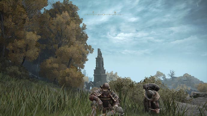 A warrior sits in the grass next to Boc the Seamster on a grassy hill in Elden Ring