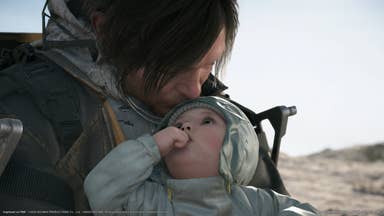 Death Stranding 2 screenshot showing close up of Sam Porter-Bridges kissing the head of a baby