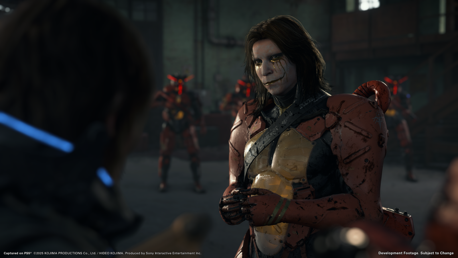 Higgs in Death Stranding 2, in mech suit with long hair and white Kiss-style makeup