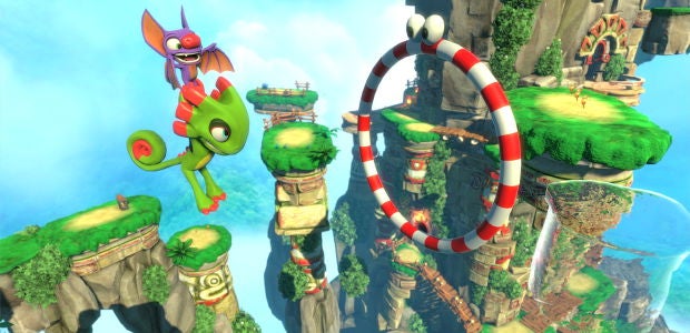 A green lizardy thing with a bat pal jumping through a hoop - 1