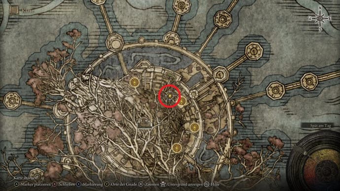 An overhead map showing a location marked in a red circle inside a large, circular city in Elden Ring