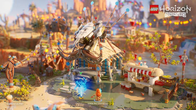 Lego Horizon Adventures screenshot showing a buildable Lego construction amongst a small village.