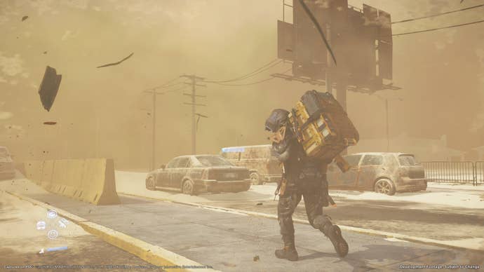 Death Stranding 2 screenshot showing Sam carrying packages through an urban environment in a sandstorm