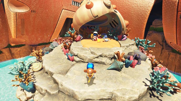 Astro Bot rescues a bot on a coral island.