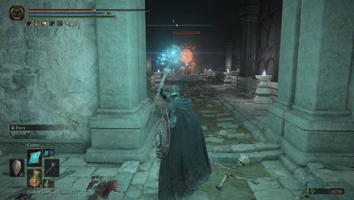 Firing magical comets at a giant imp from behind cover in Elden Ring: Shadow of the Erdtree.