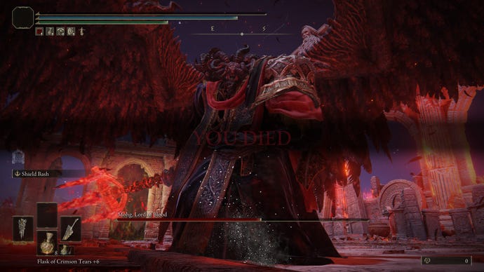 “YOU DIED” is displayed on the screen as Mohg stands above a fallen Elden Ring Tarnished with his wings outstretched.