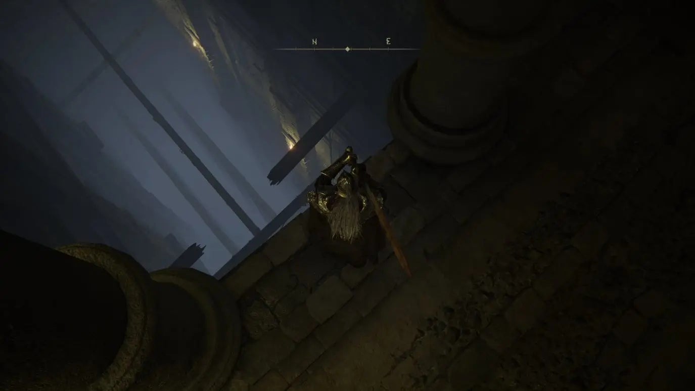 A warrior looks down at a series of rickety wooden beams in Auriza Hero&rsquo;s Grave in Elden Ring