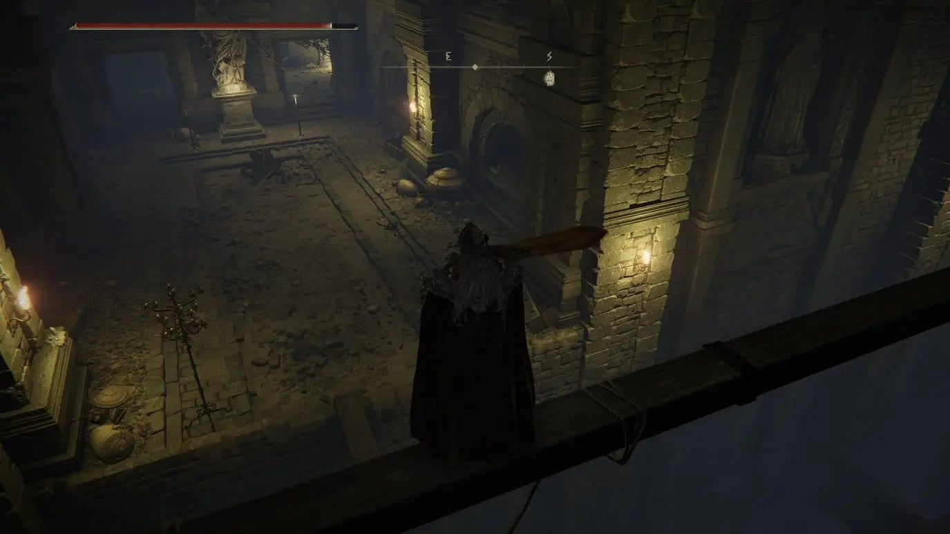 A warrior overlooks a large chamber inside Auriza Hero&rsquo;s Grave in Elden Ring