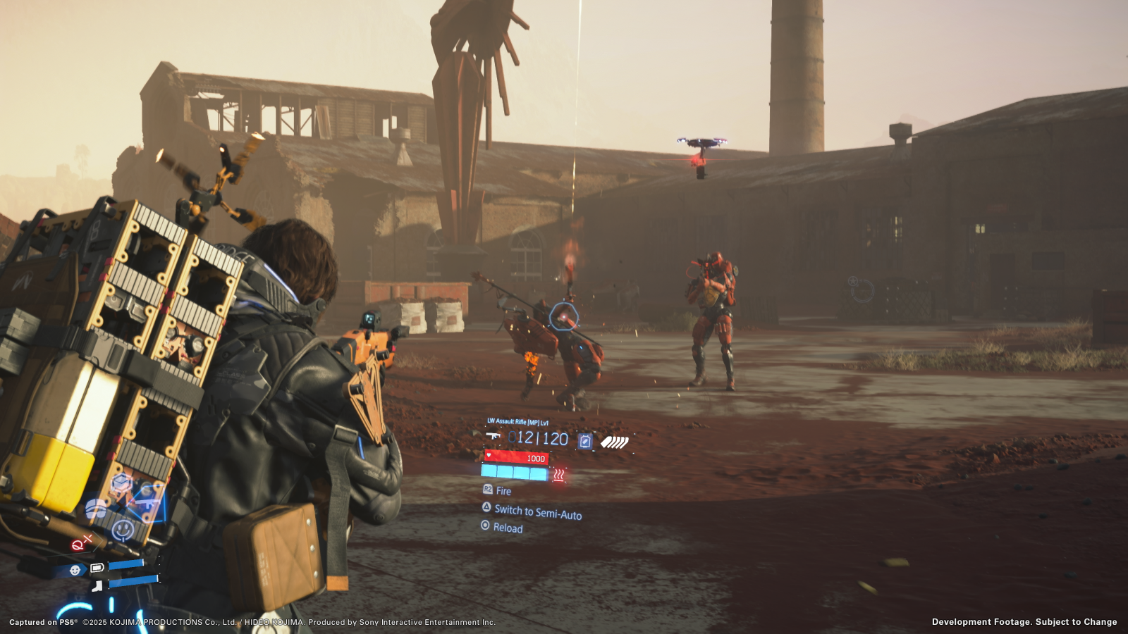 Death Stranding 2 screenshot showing Sam aiming a gun at strange red mech enemies outside an industrial facility