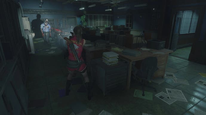 Claire aims at a zombie across a busy office in Resident Evil 2 Remake fixed camera mod