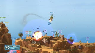 A Worm pilots a helicopter over the map while dropping explosives in Worms WMD