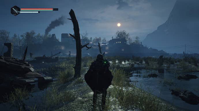 A moonlit nocturnal view of man in a black poncho looking out over a swamp littered with bodies, broken trees and abandoned tanks, with a town on a rise in the distance. From the videogame Hell Is Us.