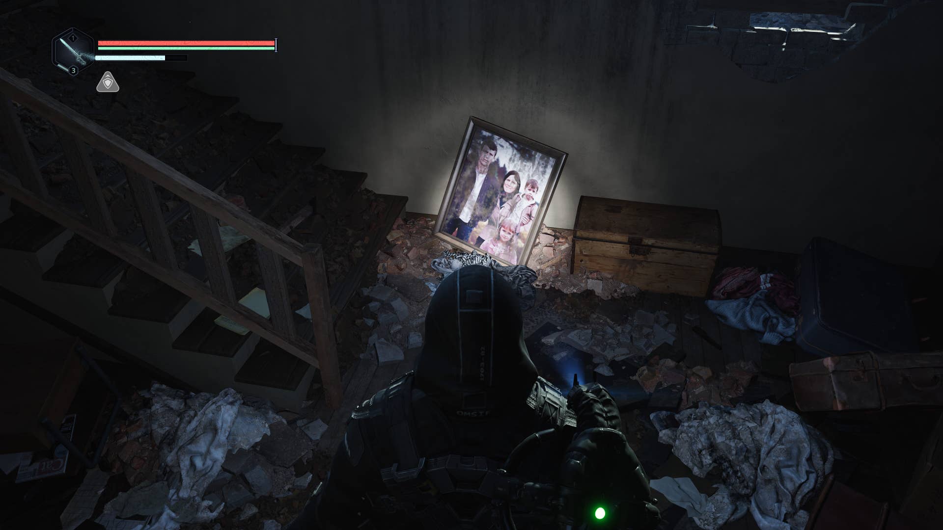 A third view of a man in a black hooded poncho looking at a photo of a family lit up by a torch of a house strewn with tiled rubs. Hell is us from video games.