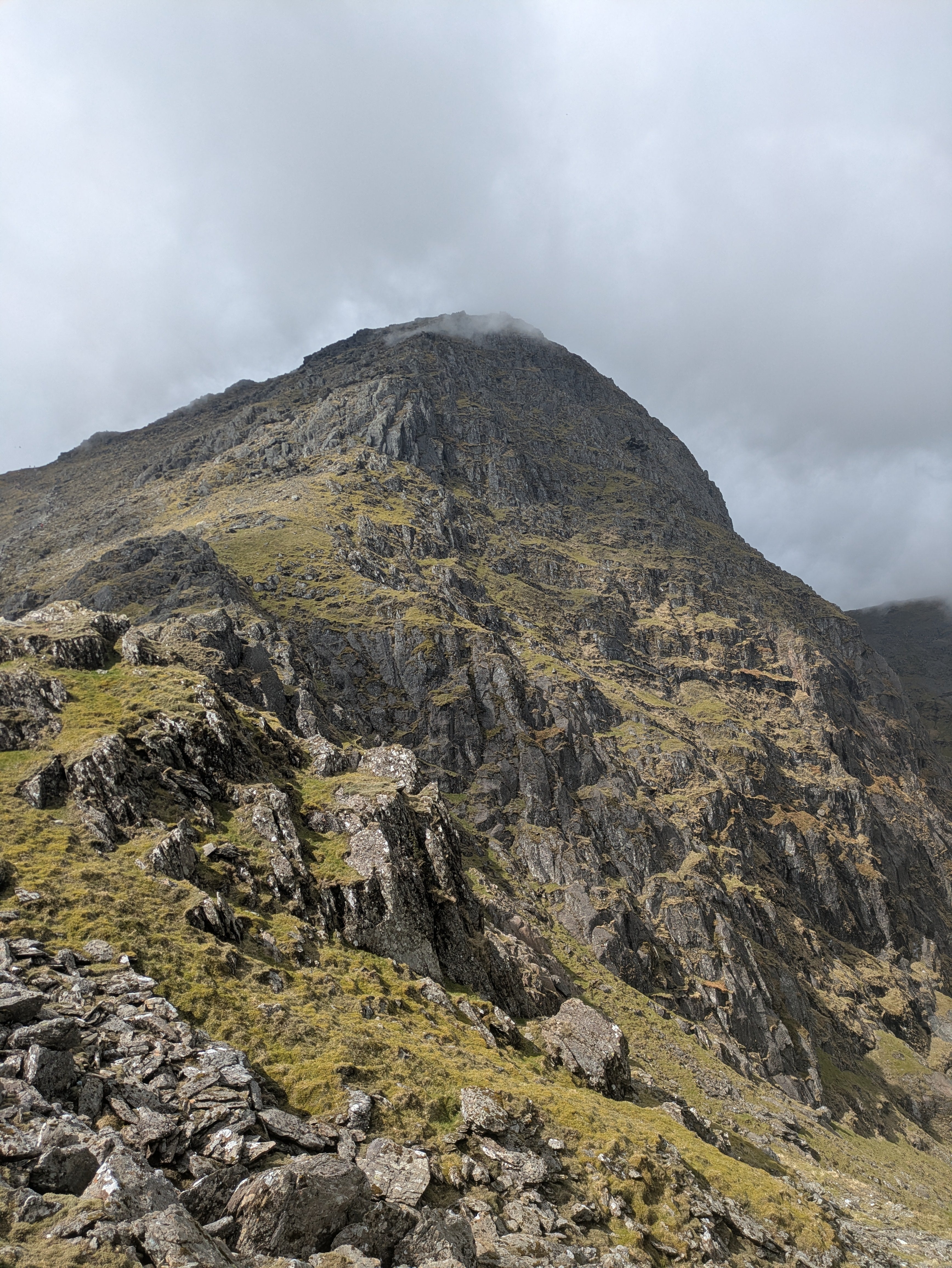 A view of a mountain peak touching cloud in Eryri.