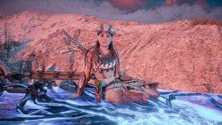 Aloy sits on top of a Tallneck in Horizon Forbidden West