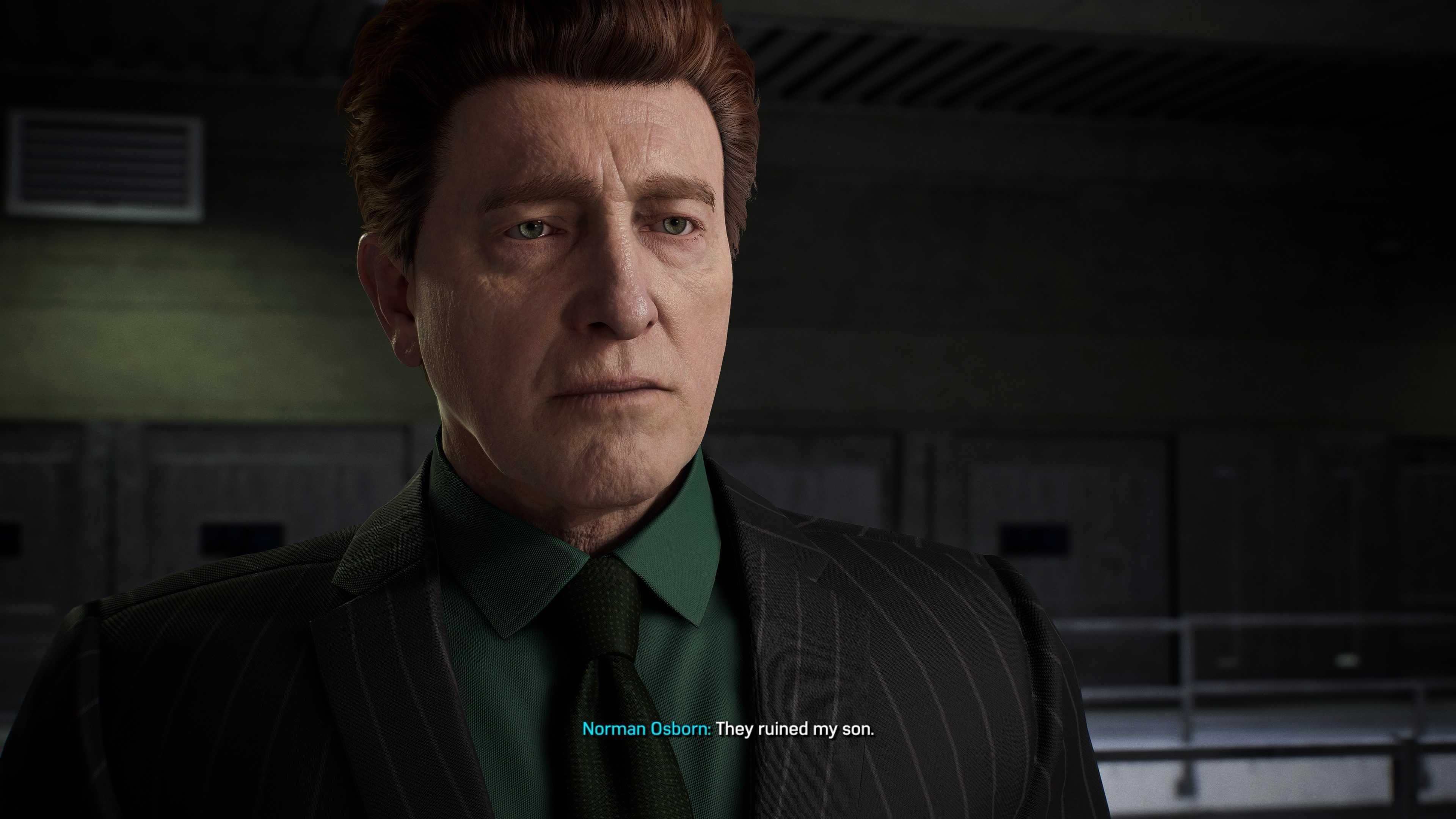 Norman Osborn visits Dr. Octavius in Marvel&rsquo;s Spider-Man 2. He is wearing a suit with a dark tie and a green shirt.