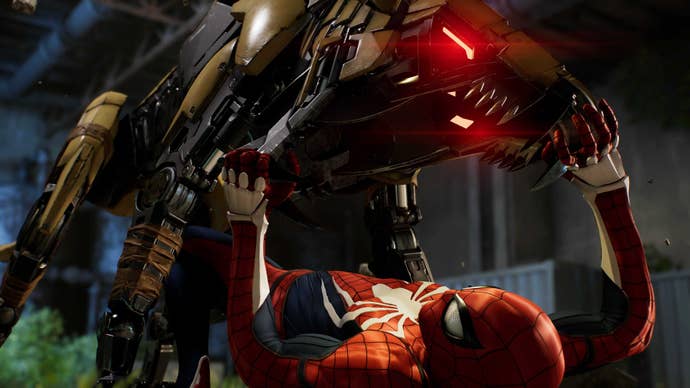 Peter Parker as Spider-Man fights off one of Kraven’s mechanical dog enemies in Marvel’s Spider-Man 2