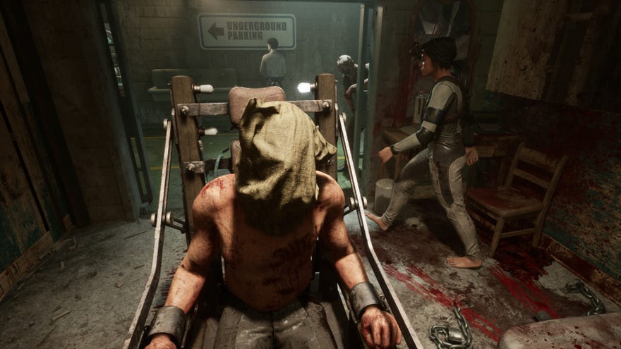 A bloodied man tied to a chair with a sack over his head