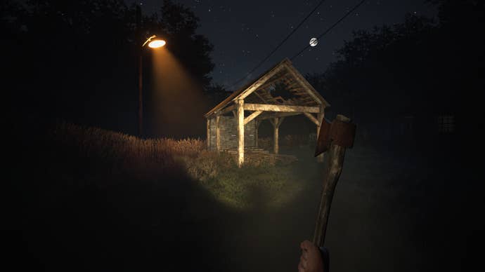 A nighttime clip first-person presumption of an open-walled woody store nether an electrical lamp successful the woods