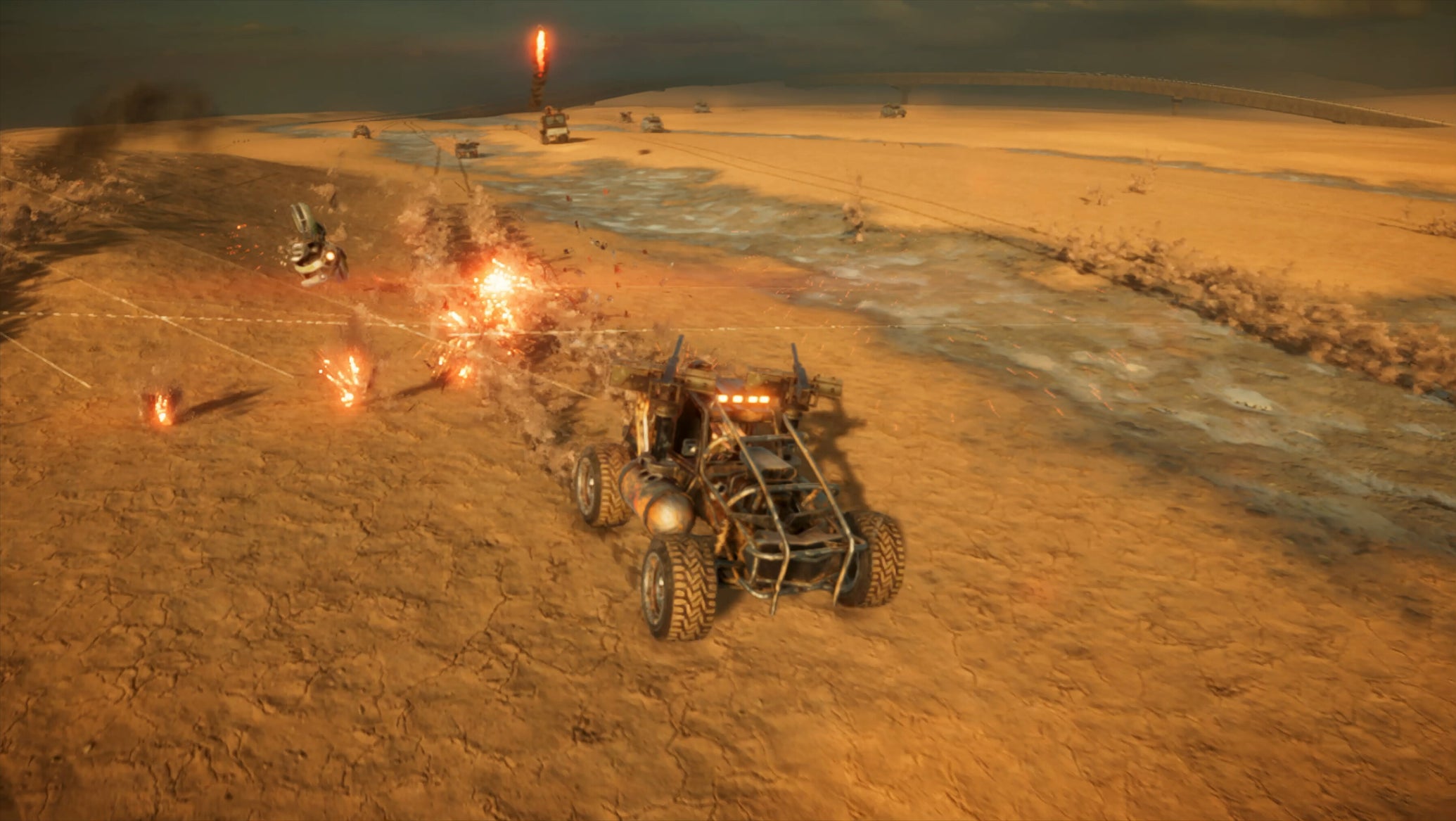 A wasteland car made of spiky bits and rust driving over the desert with lots of explosions in Drivers of the Apocalypse - 1