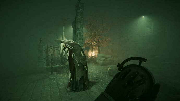 A hooded figure with a bird mask on a foggy street in Pathologic 3