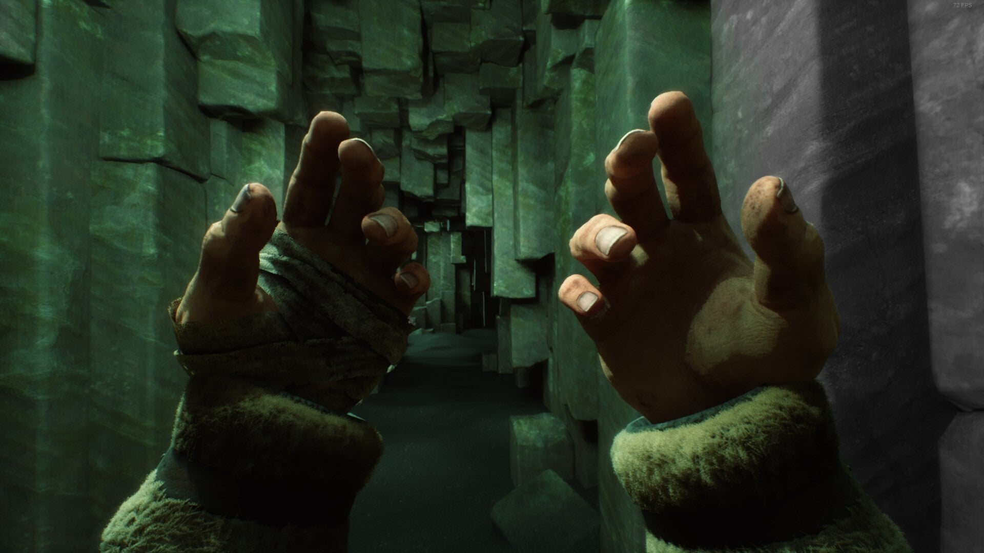 A pair of hands held up to the camera in a weird cave, from Stygian: Outer Gods - 1