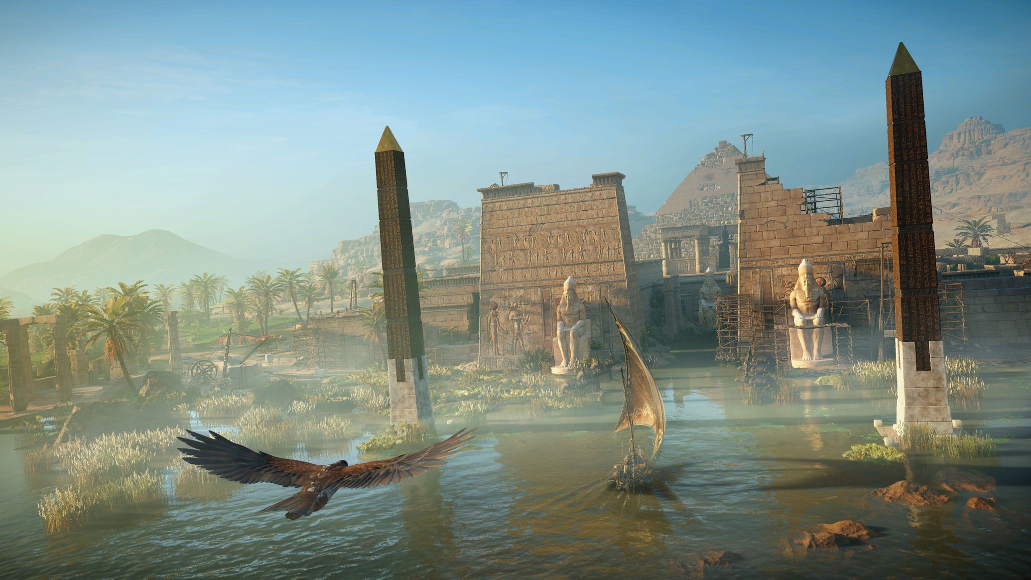 A temple and obelisks jutting out of a blue river with trees behind and hazy hills and an eagle flying in the foreground. From Assassin's Creed Origins. - 1