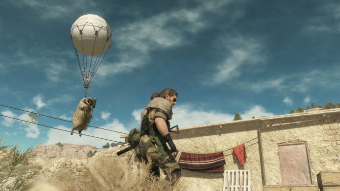 A sheep being airlifted by a Fulton balloon in Metal Gear Solid 5, with the main character Snake in the foreground near a building