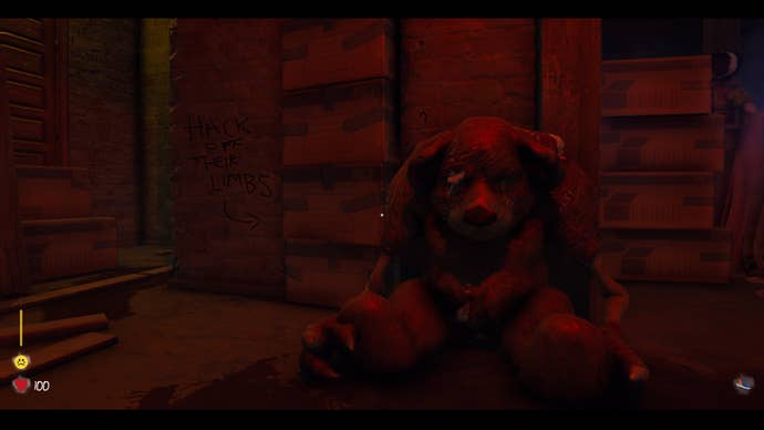 A slumped monster bear with a message on the wall to the left