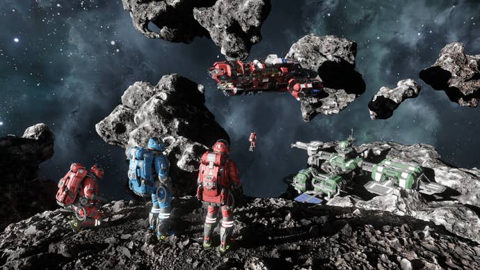A bunch of astronauts in red and blue spacesuits standing on an asteroid looking at passing starships in Space Engineers 2