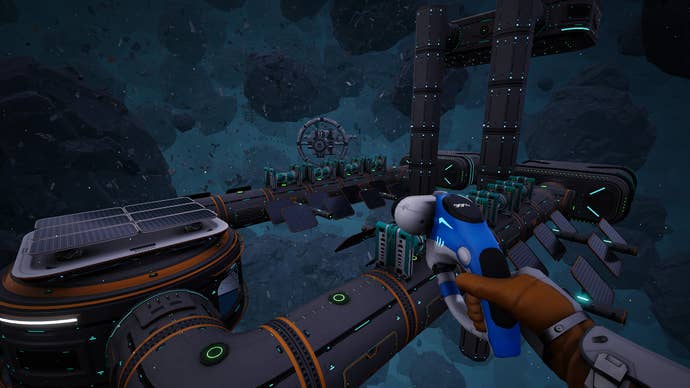 A first-person view of an astronaut flying over a big modular space station in Astrometica