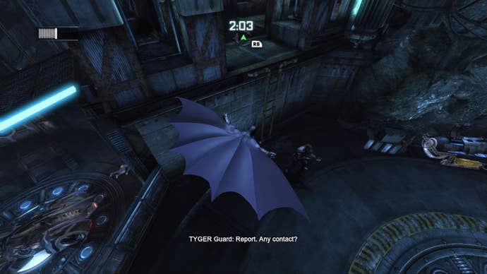 Batman swoops through the Batcave, cape billowing in this screen from Batman Arkham City. Text reads “TYGER GUARD: Report. Any contact?"