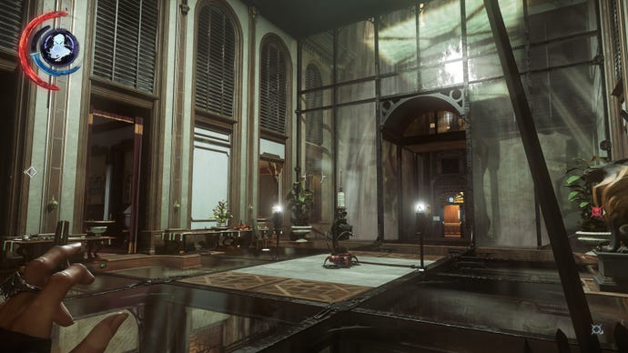 The interior of a large waiting room with a sentry gun in the middle of it in Dishonored 2