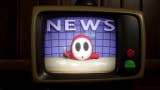 A newsreader Shy Guy presenting the 10 o'clock, viewed on an analog TV