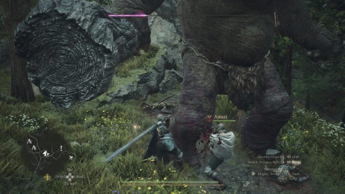 Two Warriors hacking away at a cyclops' legs in Dragon's Dogma 2.