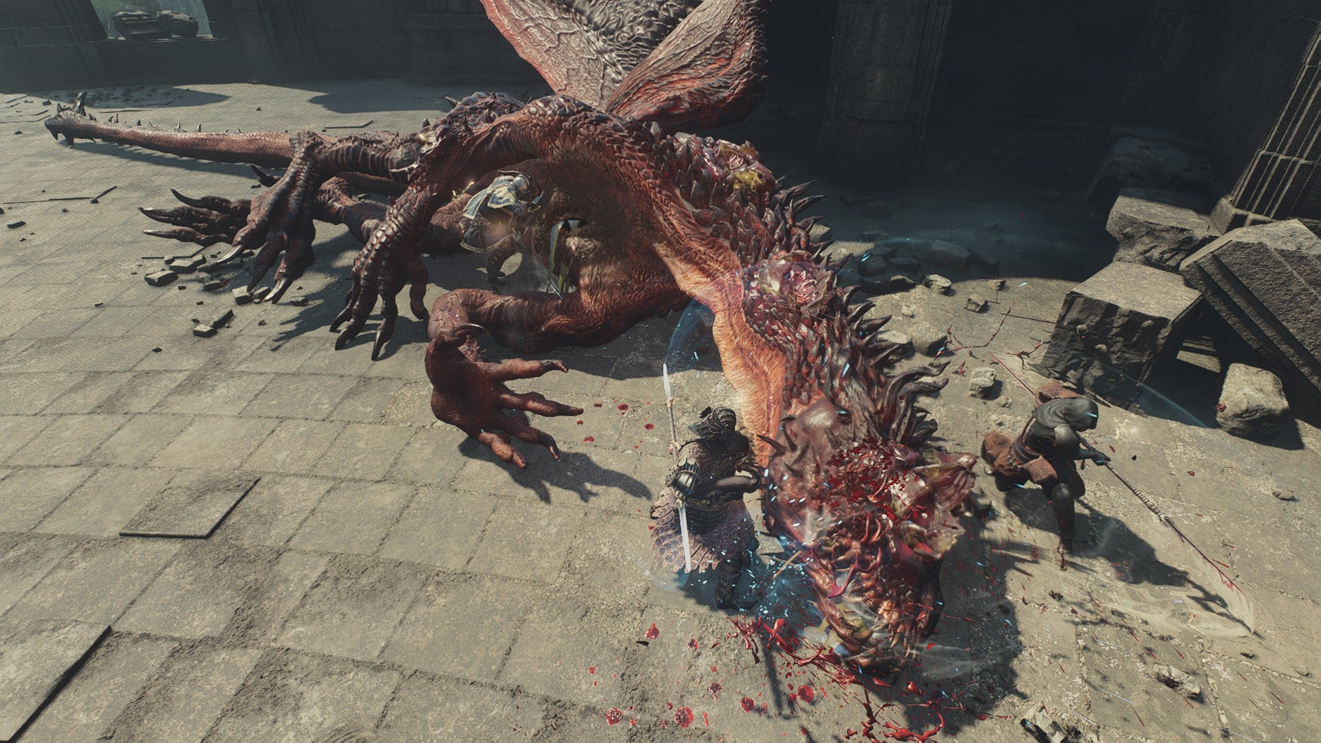 A party of adventurers slash the head of the drake at the top of Dragonsbreath Tower in Dragon's Dogma 2. - 7