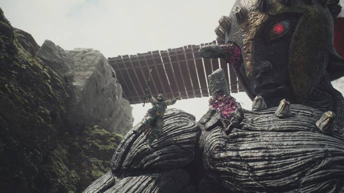 Jumping on the body of the Gigantus in Dragon’s Dogma 2.