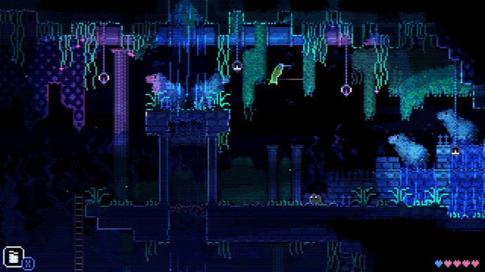 A cave in Animal Well with dangling vines and a hummingbid perched above a high ledge