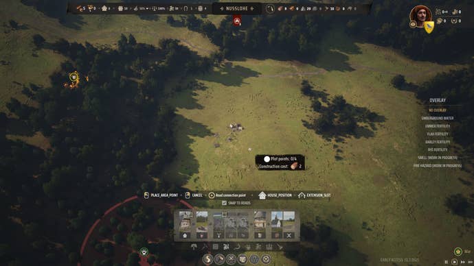 How Manor Lords begins. A view of a small tent of settlers from a bird’s eye view above.