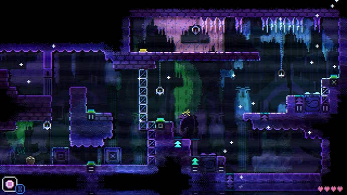 An aquatic grotto in Aminal Well with purple and blue rock fixtures and lines of blocks