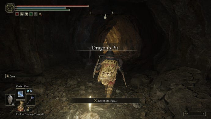 A screenshot showing the entrance to the Dragon's Pit dungeon in Elden Ring: Shadow of the Erdtree.