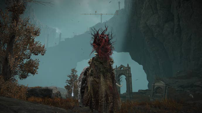 A warrior looks up at a ridge from Belurat to Enir-Ilim to claim the Incursion painting reward in Elden Ring Shadow of the Erdtree.