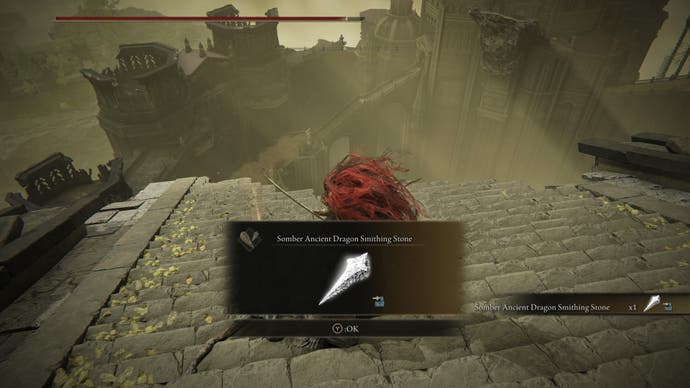 A warrior retrieves a Somber Ancient Dragon Smithing Stone from a corpse inside Enir Ilim in Elden Ring Shadow of the Erdtree.