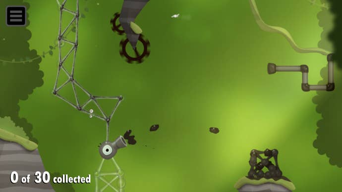 A goo spitter spits oil towards a pile of goo balls in this screen from World of Goo 2.