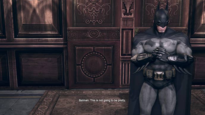 Batman stands in a hall in Wayne Manor in this screen from Batman Arkham City. Text reads “Batman: This is not going to be pretty."