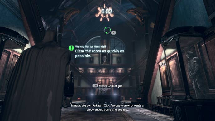 The main foyer of Wayne Manor in Batman Arkham City. Text reads “Clear the room as quickly as possible."