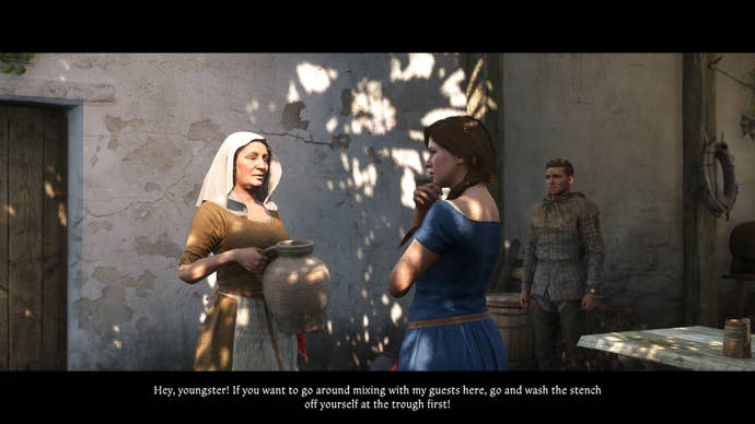 Two women talking near a tavern in Kingdom Come: Deliverance 2
