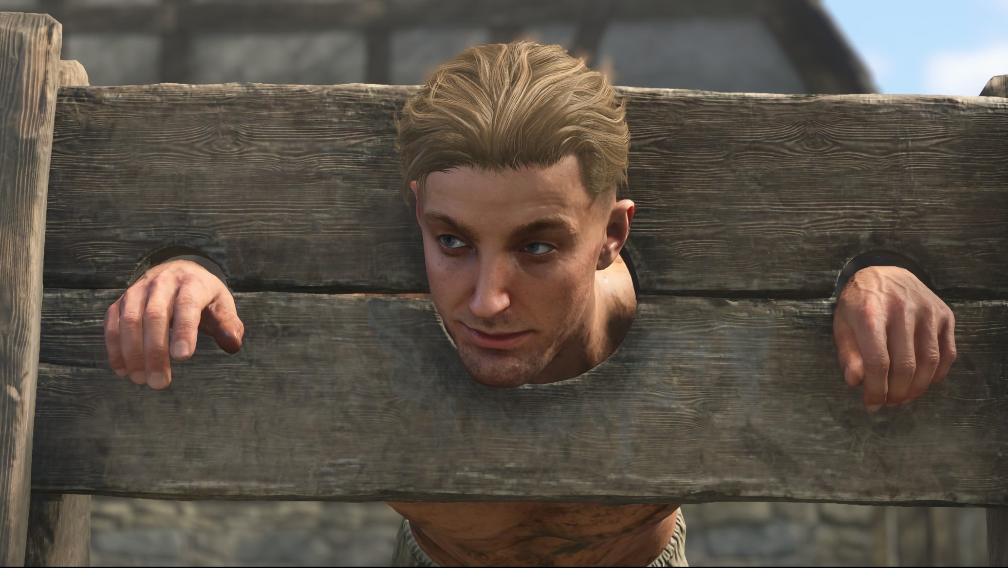 A blond man in the stocks in Kingdom Come: Deliverance 2 - 1