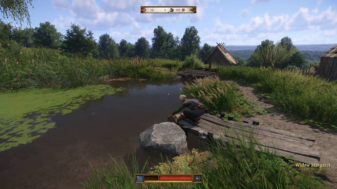 A view of a woman washing clothes in a pond in Kingdom Come: Deliverance 2